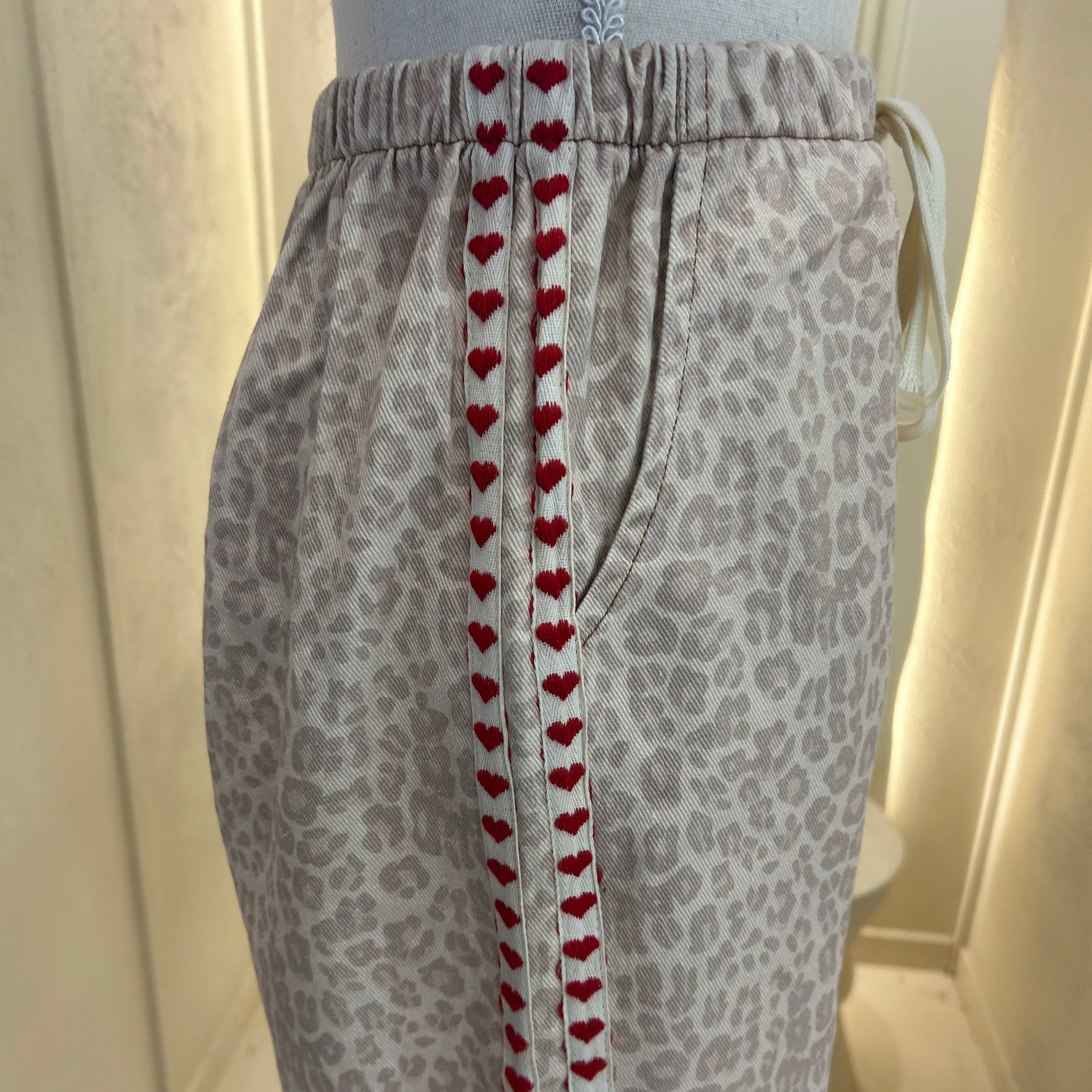 cream leopard with red heart racer - by Frankie